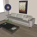 White Leather Three Seater Sofa with Pillows and Wall Art in Living Room with Floor Lamp