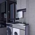 Modern Laundry Area With Black Countertop White Sink Washing Machine And Dryer