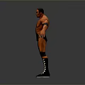 Shirtless Male Wrestler In Black Trunks With Wristbands And Checkered Boots On Gray Background