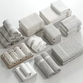 White and Light Gray Towels with Various Folding Styles in Neatly Stacked Arrangement