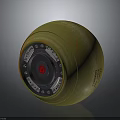 Green Round Military Weapon Featuring Orange Marks Red Central Symbol And Metal Parts