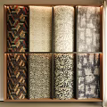 Various Colorful Patterned Fabric Samples Arranged On Display Shelf