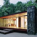 Contemporary Detached Villa With Stone Walls Large Glass Windows And Wooden Steps In Lush Forest