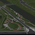 Scenic Urban Park Landscape With River Green Lawn Winding Pathways And High Rise Buildings