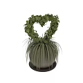 Heart Shaped Green Foliage Bonsai Plant With Long Slender Leaves In Gray Container