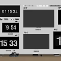 Multiple Televisions Mounted on Wall with Digital Number Displays and Devices Below