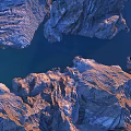 Breathtaking Garden Landscape With Snow Covered Mountains Rocky Terrain Calm Lake And Sunset Sky
