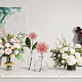 Beautiful Flower Vases with Pink Dahlias White Blooms and Blue Blossoms on Countertop
