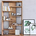 Modern Wooden Bookcase With Open Shelves Holding Books Decorative Items And Plant Prints
