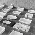 Various Shapes And Materials Of Modern Washbasins White Black Marble On Grey Floor With Faucets