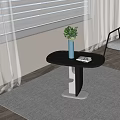Modern Black Oval Top Side Table With Metal Base Blue Vase Green Plant And Open Book