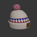 White Knitted Beanie With Pink Pom Pom And Blue Red Geometric Pattern Design