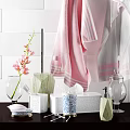 Elegant Bathroom Accessories With Pink White Towels Flowers And Tissue Box