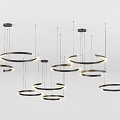 Multiple Circular Chandeliers With Black Frames and Illuminated Light Strips Hanging From White Ceiling 3d model