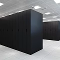 Industrial Server Room Featuring Rows Of Black Server Cabinets White Ceiling Lights And Spacious Aisle