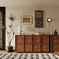 Wooden Decorative Cabinet With Sculpture Vase And Wall Art Near Potted Plant On Geometric Rug