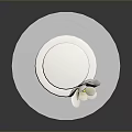 Two Tiered White Cake With White Flower Decoration On Silver Round Tray