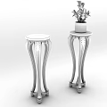 Two Wooden Plant Stands with Carved Legs and Potted Green Plant