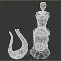 Clear Glass Wine Bottle With Red Liquid Golden Cap And Curved Striped Wine Glass