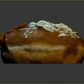 Intricate Donut Sculpture Carving With Orange White Crumbs And Brown Glaze Design