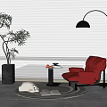 Red Comfortable Lounge Chair With Small Round Table Fruits Floor Lamp Plant Blinds Rug And Book