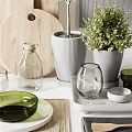 Natural Style Kitchen Utensils With Wooden Cutting Boards Olive Oil Bottles And Green Plants