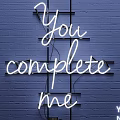 White Neon Decorative Light with You Complete Me on Blue Brick Wall and Black Frame