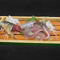 Fresh Fish Sashimi Slices in Wooden Box with Shiso Leaves Daikon Shreds and Wasabi