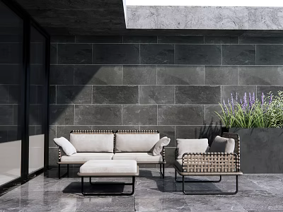 Outdoor Woven Rattan Sofa With Ottoman And Purple Plants On Patio Gray Stone Wall 3d model