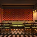 Modern Industrial Restaurant Interior With Green Booth Seating Round Tables Pendant Lights And Checkerboard Floor