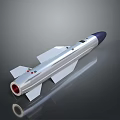 Silver Rocket Model With Blue Nose Red Nozzle Fins And Reflective Dark Background