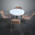 Round Marble Top Table With Four Rattan Chairs And Metal Frames