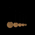 Round Cream Colored Pendant Lights With Moon Surface Texture Hanging In Modern Interior