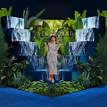 Floral Art Installation With Green Plants Waterfall Effect Backdrop And Steps