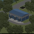 Industrial Factory Building With Blue Roof Surrounded By Green Trees And Parking Area Near Road