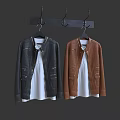 Black And Brown Leather Jackets Hanging With White Inner Shirts On Hangers