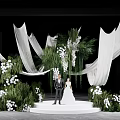 Wedding Stage Floral Installation With White Flowers Greenery And Flowing Fabric For Couple
