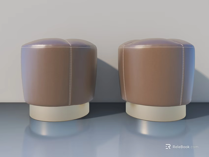 Two Brown Round Stitched Stools With Light Colored Base On Smooth Floor 3d model