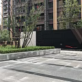 Modern Feature Wall Design With Green Lawn Trees And Paved Ground In Front Of Building