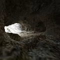 Natural Cave Scenery With Sunlight Streaming Through Top Opening And Rough Rock Formations