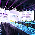 Modern Conference Event Venue With Stage Backdrop Screens Long Tables Chairs And Lighting