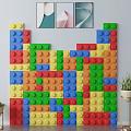Colorful LEGO Brick Decorative Wall With Framed Artworks And Potted Plants