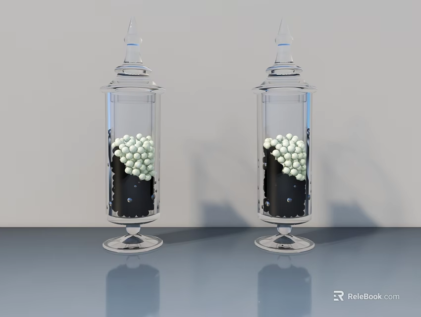 Two Transparent Ceramic Vessels With White Spherical Objects And Black Base On Grey Countertop 3d model 