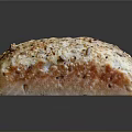 Delicious Freshly Baked Bread with Golden Crust Sesame Seeds and Nuts on Dark Background