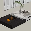 Modern Living Room Stacked Coffee Tables Black White Marble Top Green Plant Book Teapot Oranges