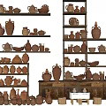 Collection of Hand Carved Ceramic Sculptures on Wooden Shelves and Cabinets