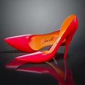 Red Pointed Toe High Heels With Stiletto Heel Orange Sole On Shiny Reflective Surface