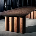 Modern Wooden Round Table With Unique Fluted Legs In Interior Setting