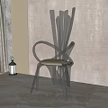 Modern Single Chair Featuring Unique Backrest In Minimalist Setting With Green Plant