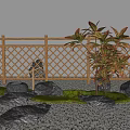 Bamboo Fence In Garden With Rocks And Plants